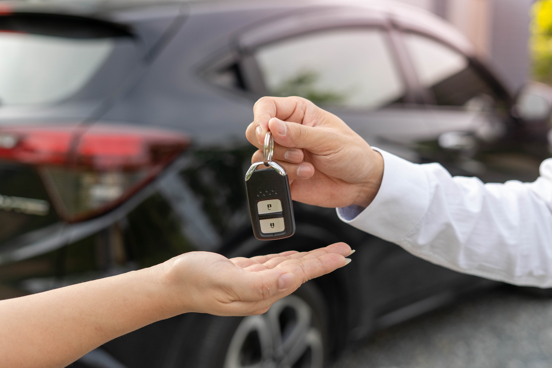 Person Handing Car Keys